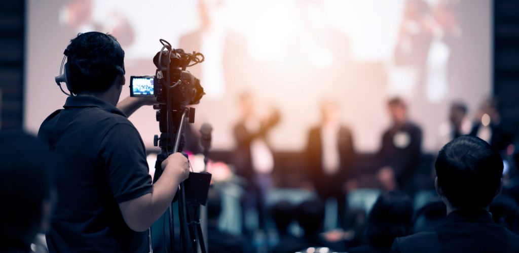 Video,Camera,Operator,Working,With,His,Equipment,At,Indoor,Event.