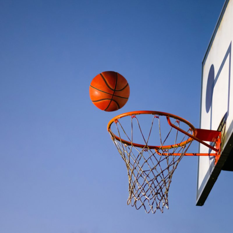 Street,Basketball,Ball,Falling,Into,The,Hoop.,Close,Up,Of